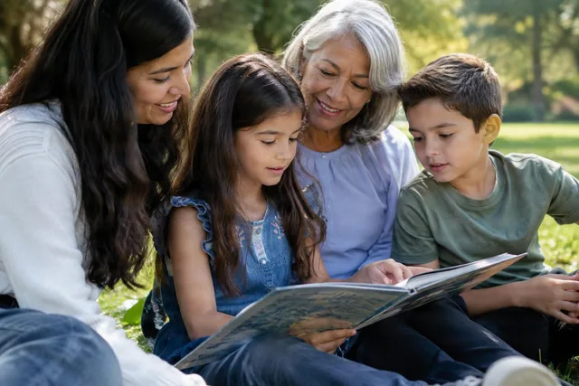 Family Reading Together Outdoors
