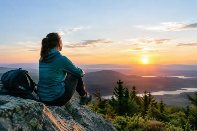 Hiker Pausing at Sunrise Outlook