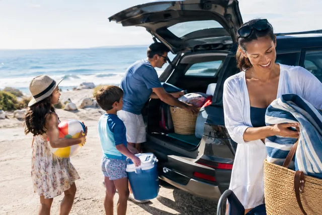 Family Unloading Beach Gear