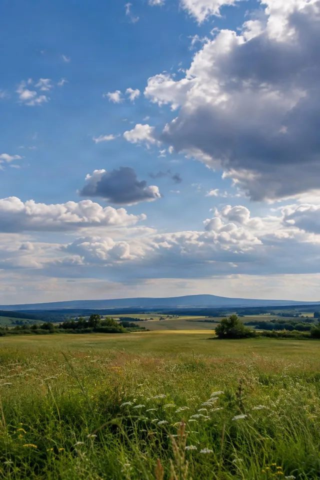 Cumulus Clouds Over Rolling Fields