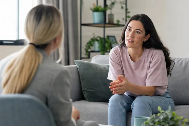 Supportive Therapy Conversation on Sofa