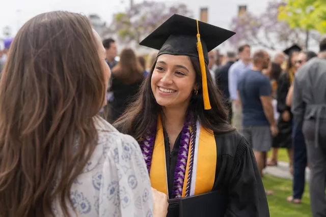 Graduate Greeting Family Outdoors