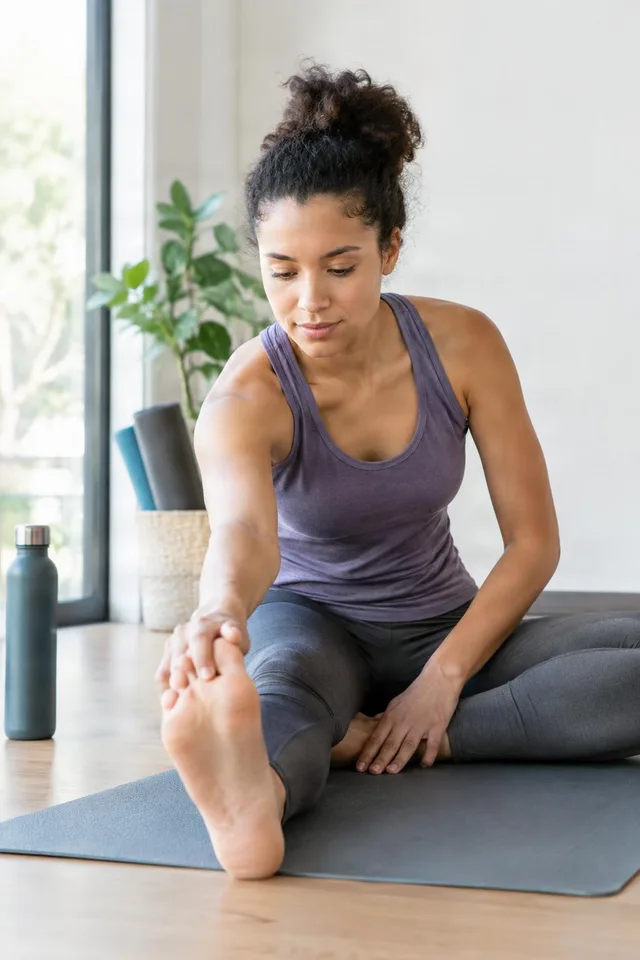 Woman Reaching for Foot Stretch