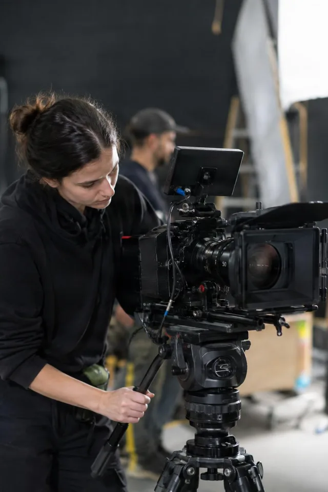 Camera Operator Adjusting Cinema Rig
