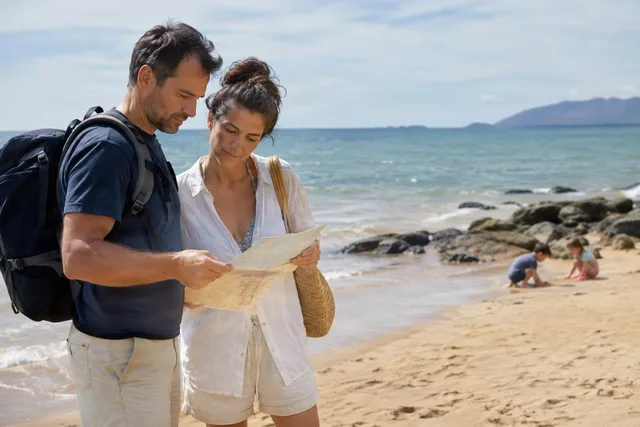 Couple Checking Map on Beach
