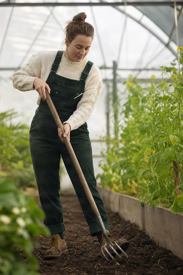 Gardener Using Hand Fork