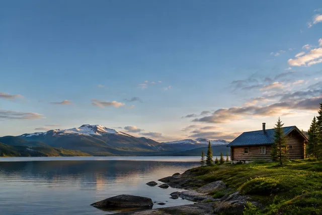 Lakeside Wilderness Cabin Under Open Sky