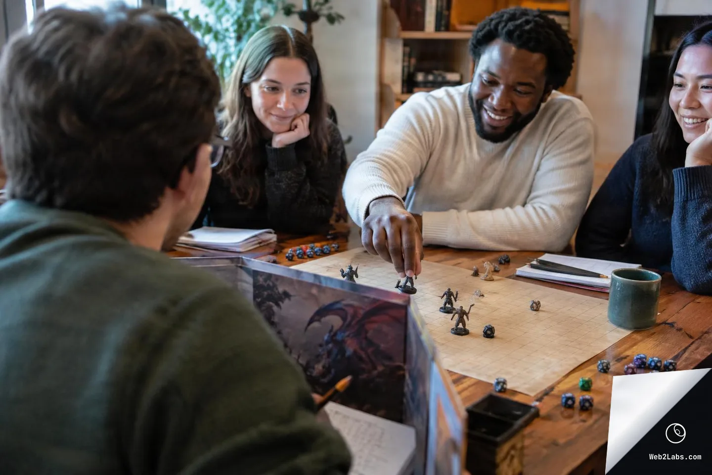 Over-the-shoulder view of a tabletop roleplaying game: a game master behind a GM screen faces three smiling players as one moves a miniature on a gridded battle map surrounded by dice and notebooks.
