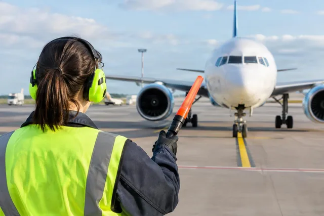 Marshaller Guiding Jet to Stand