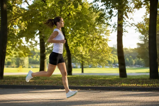 Woman Jogging in Sunny Park