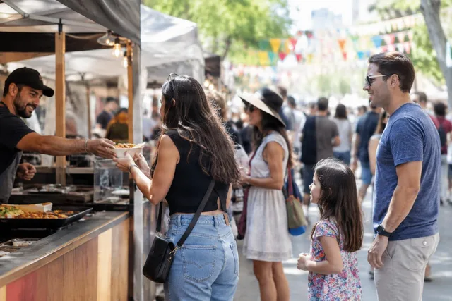 Family Buying Food at Street Festival