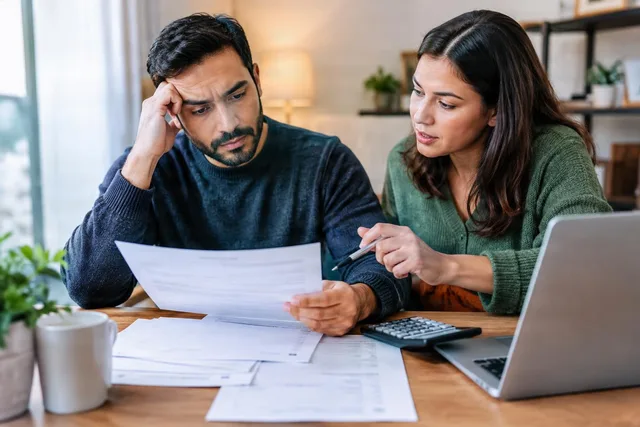 Couple Reviewing Bills Together