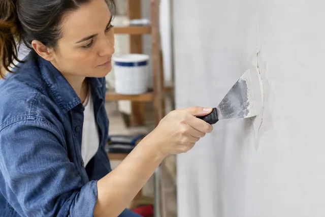 Patching Wall With Putty Knife