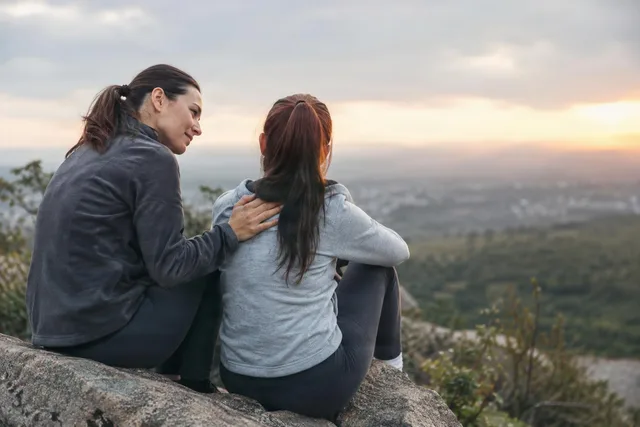 Supportive Moment at Sunset Overlook