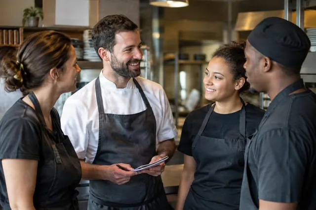 Restaurant Team Briefing in Kitchen