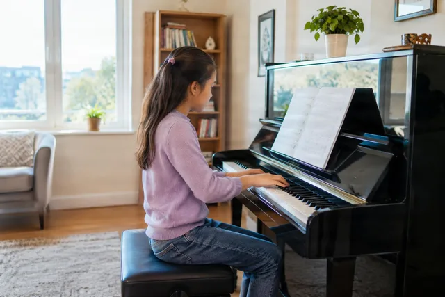 Child Practicing Piano at Home