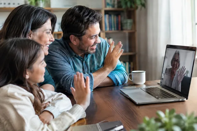 Family Waving on Video Call