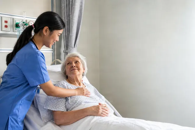 Nurse Comforting Elderly Patient