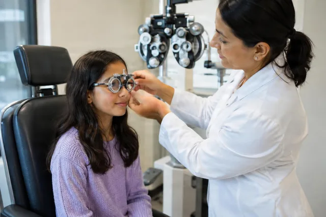 Optometrist Fitting Trial Frames