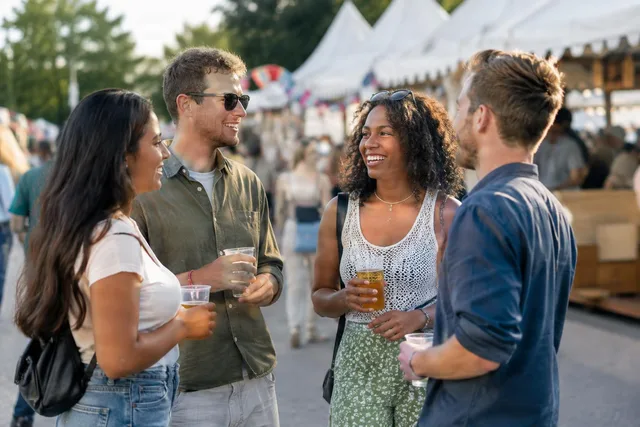 Friends Chatting at Street Festival