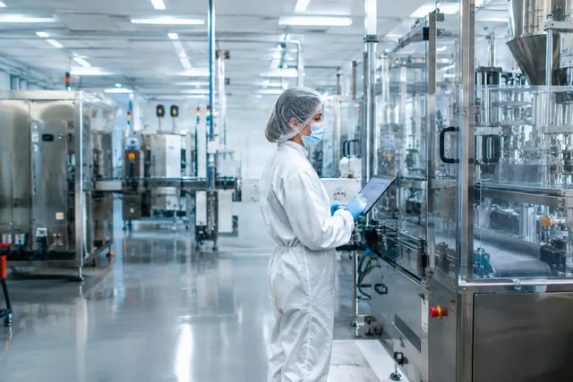 Technician Monitoring Clean Production Line