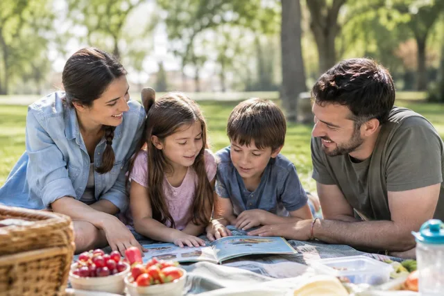 Family Picnic Reading Together