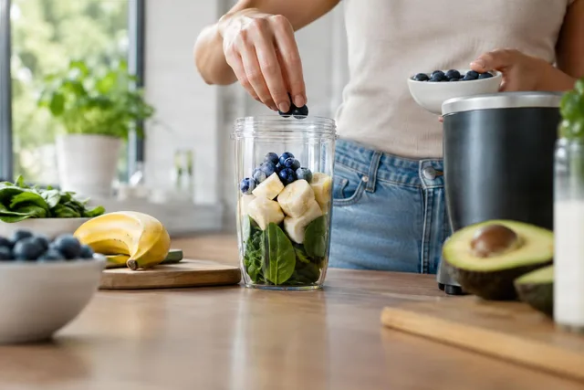 Adding Berries to Smoothie Cup