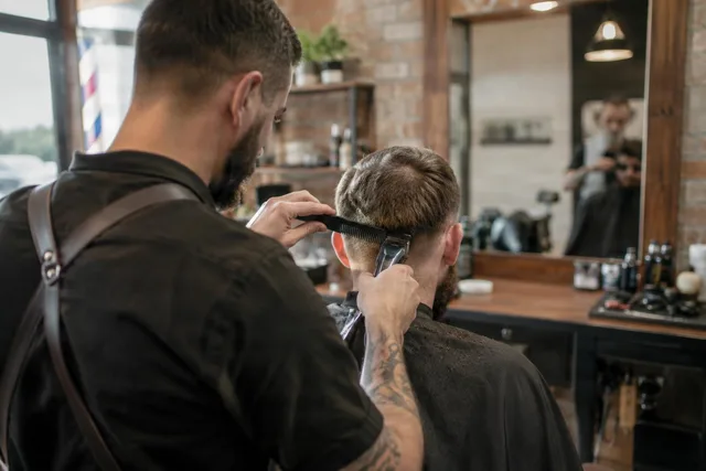 Barber Trimming Client From Behind