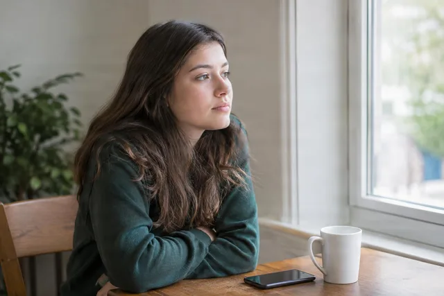 Thoughtful Woman by Window