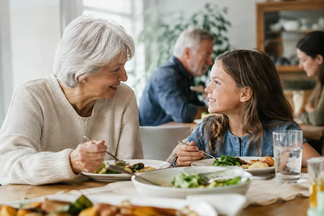 Grandmother and Granddaughter at Dinner