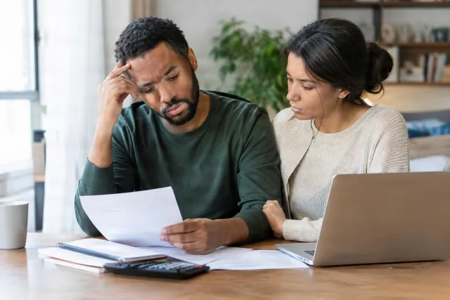 Couple Reviewing Bills at Home