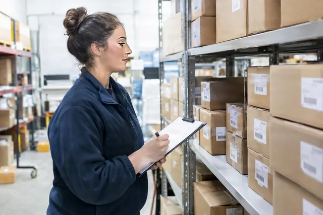 Warehouse Inventory Check With Clipboard